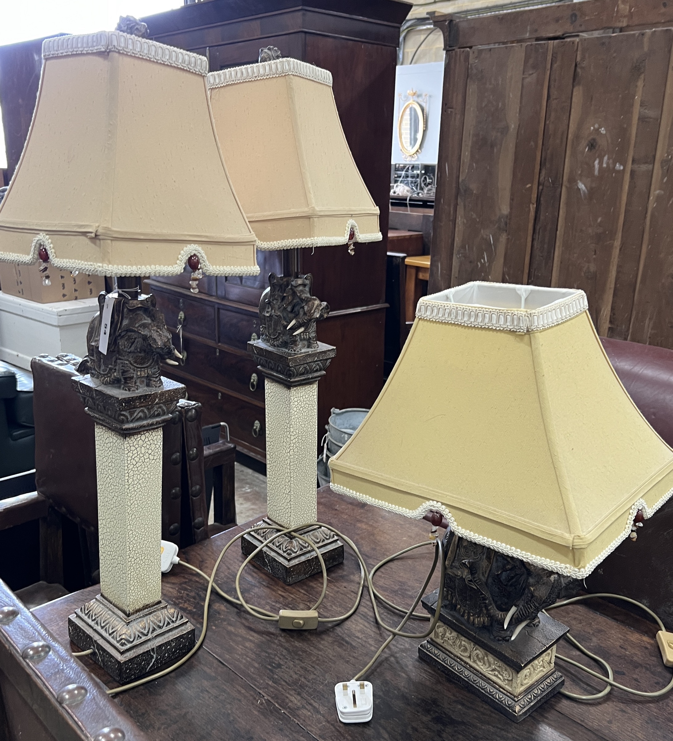 Three composition elephant table lamps, larger including shade height 86cm